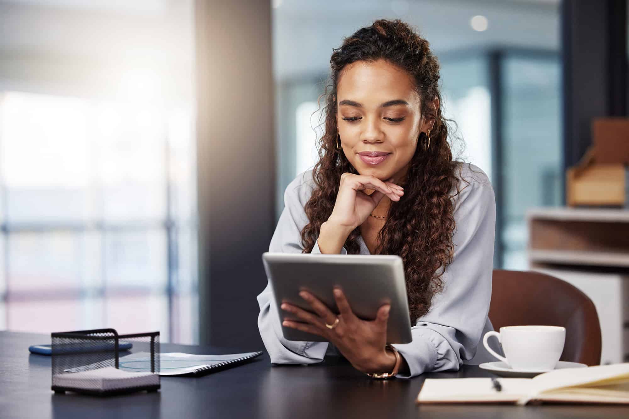 young businesswoman using a digital tablet while at work